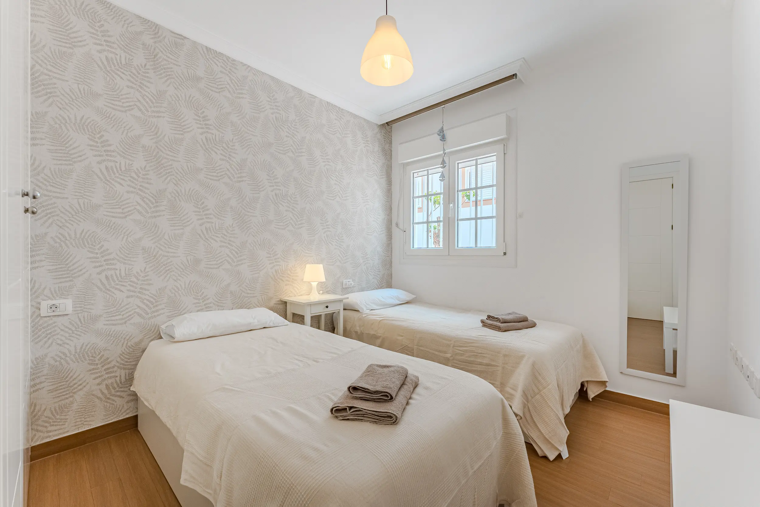 simple bedroom with bedside lighting at Azuro Stays Alcalá Tenerife