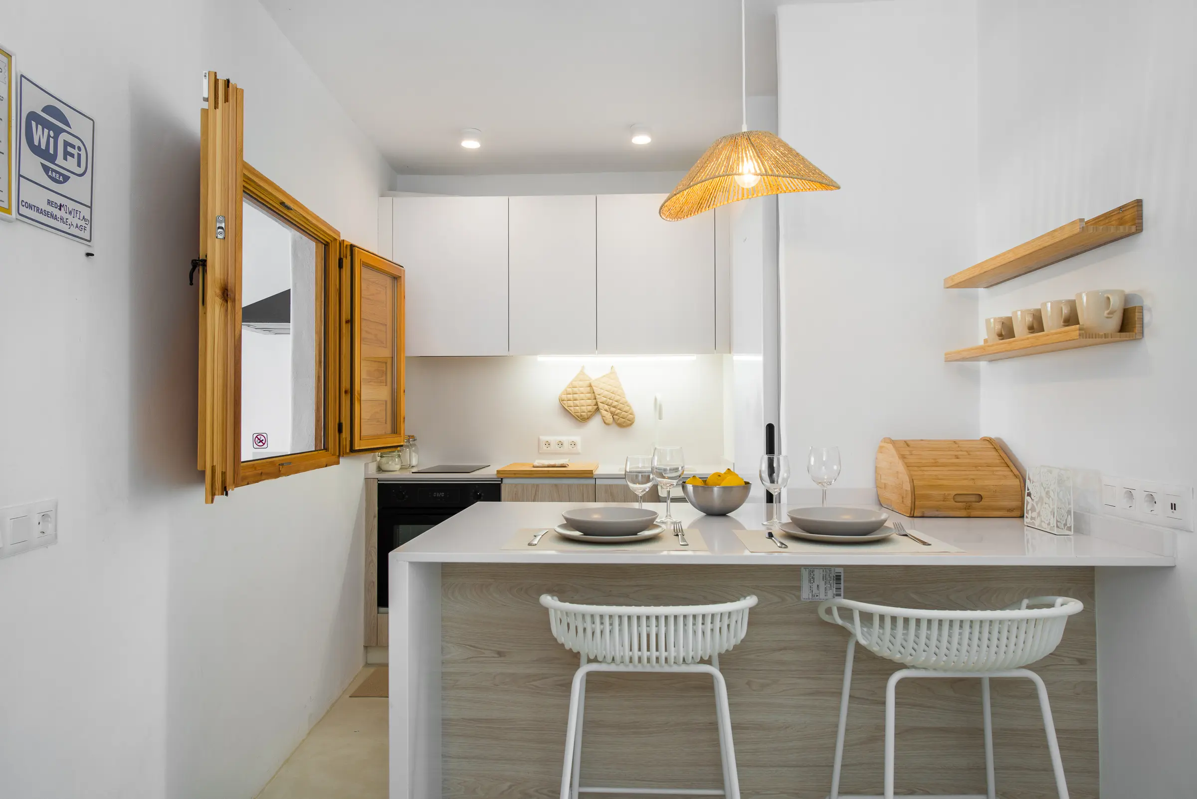 bright kitchen with bar seating at Azuro Stays Alcalá Tenerife