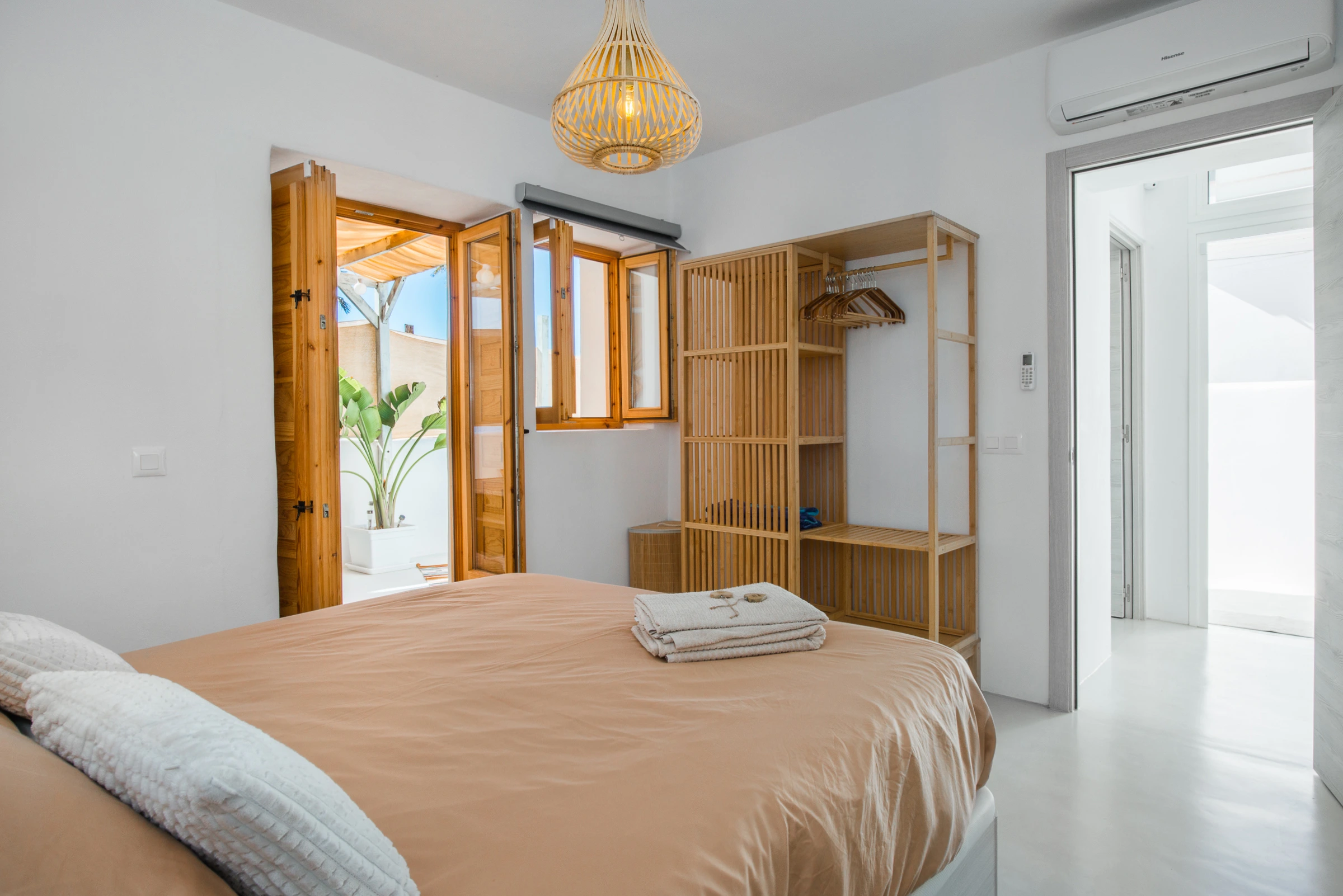 bedroom with wooden accents and natural light at Azuro Stays in Alcalá Tenerife